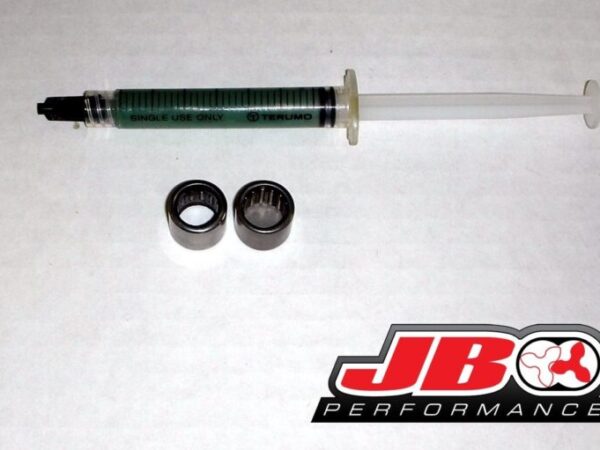 Syringe with bearings and JBO Performance logo.