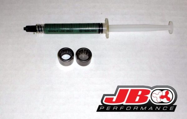 Syringe with bearings and JBO Performance logo.