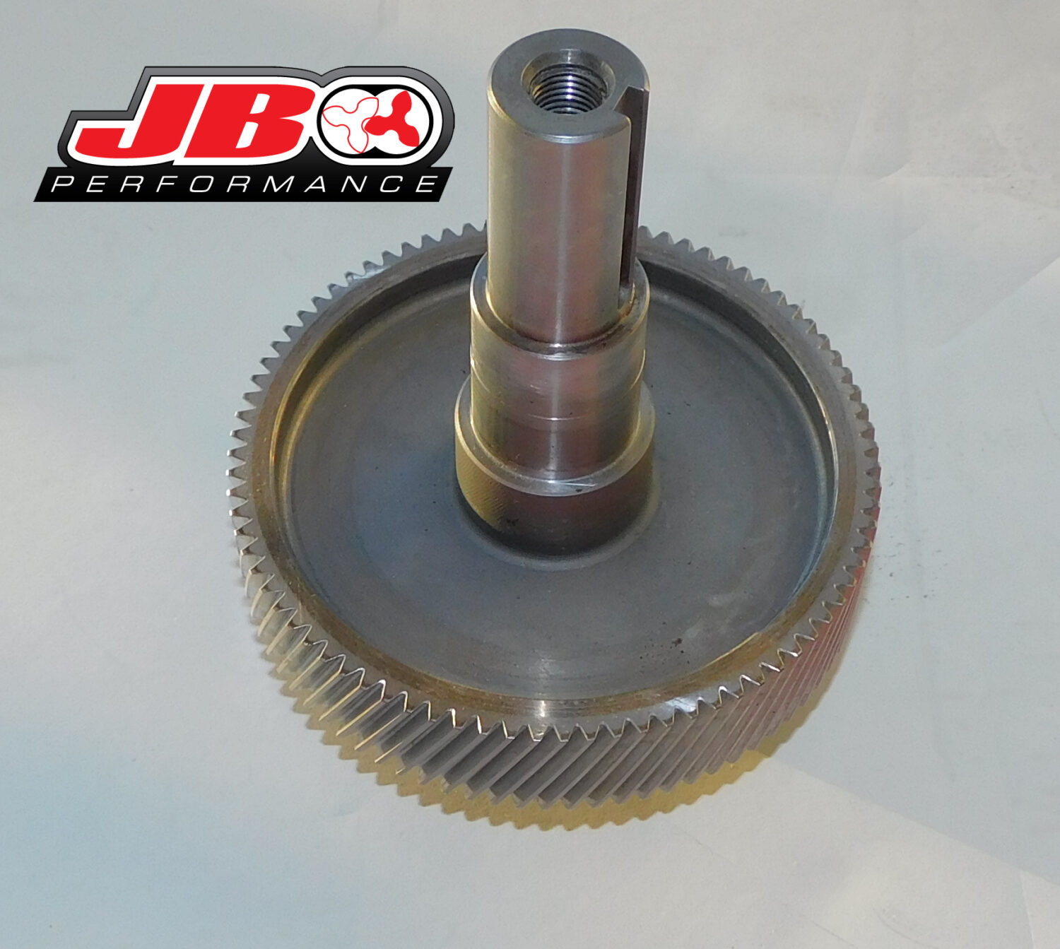 Metal gear with JB Performance logo.